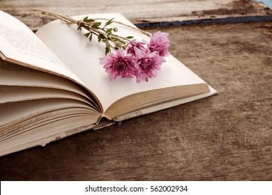 Vintage Novel Books With Bouquet Of Flowers On Old Wood Background - Concept Of Nostalgic And Remembrance In Spring Vintage Background 