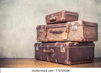 Vintage old classic travel leather suitcases circa 1940s. Travel luggage concept. Retro instagram style filtered photo - Shutterstock ID 773729206