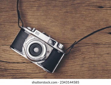 vintage old film camera on wood board with copy space - Powered by Shutterstock