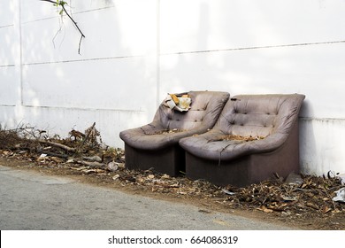 Vintage Old Grungy Ripped Abandoned Couch (sofa) Let For Garbage. Discard Sofa (couch) Outdoor Left On The Street Or Sidewalk