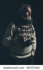 Vintage Old Mountaineer With Knitted Sweater, Fur Collar And SLR Camera.