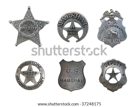 Vintage old sheriff, marshall, and police badges isolated over white