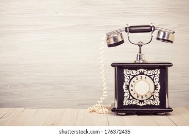 Vintage Old Telephone On Wood Table