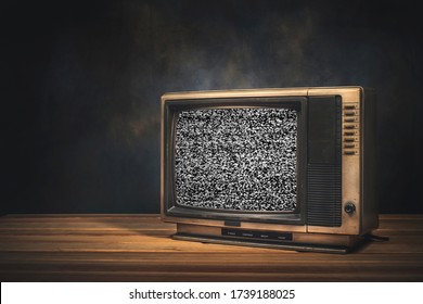 Vintage Old TV Set Is Still Life With Static Screen In The Dark Room.