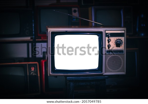 Vintage old  TV\
with white blank screen in\
room.
