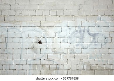 Vintage Old Whitewashed Grafitti Urban Brick Wall Textured Background. White Painted Brickwork Horizontal Texture. Abstract Dark Gray Stonewall Wallpaper.