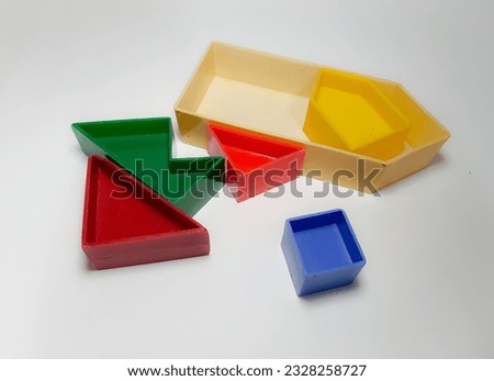 vintage one way puzzle, colorful, 5 colored plastic pieces, 5 pieces placed on a white background.