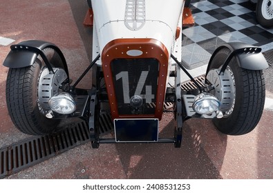 vintage open-top car at the yacht show in Monaco on a sunny day, leather seats, spoked wheels, close-up - Powered by Shutterstock