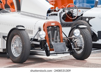 vintage open-top car at the yacht show in Monaco on a sunny day, leather seats, spoked wheels, close-up - Powered by Shutterstock