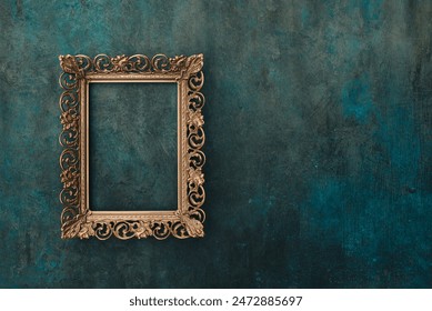 Vintage openwork bronze metal frame on a blue and green old wall with drips, texture background, empty picture frame mockup