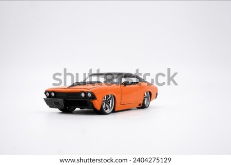 Vintage orange sedan muscle car isolated on white