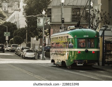 Vintage Overhead Cable Retro San Francisco Trolley Car moves through the street