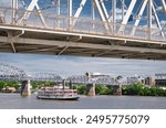 Vintage paddle streamboat cruising down the Ohio River in Cincinnati downtown