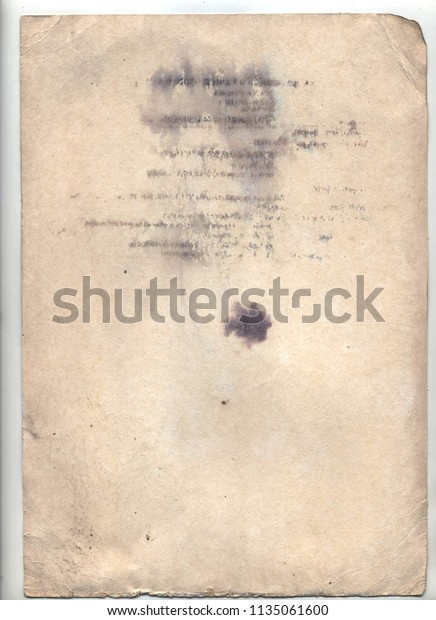 Vintage paper with folds, dark shabby edges,\
with spots and torn\
corners.