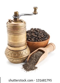 Vintage Pepper Mill And Black Peppercorn Isolated On White