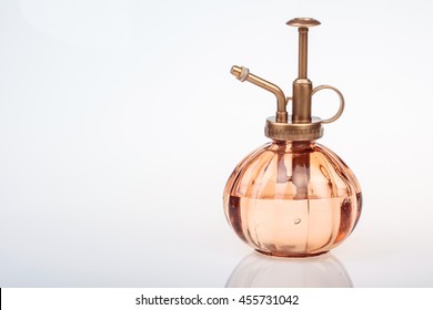 vintage perfume bottle with atomizer isolated on white background