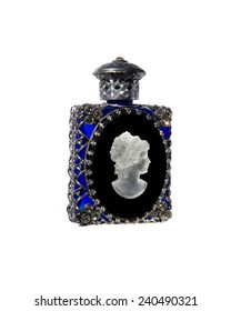 Vintage perfume bottle of blue glass and silver with bas-relief profile women of stone on  white background