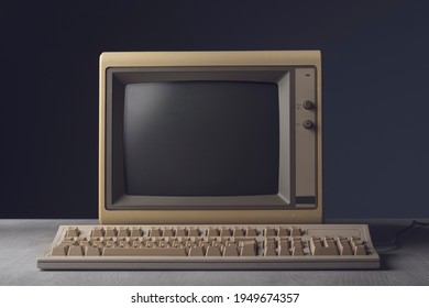 Vintage personal computer with keyboard on a desktop, outdated electronics concept - Shutterstock ID 1949674357