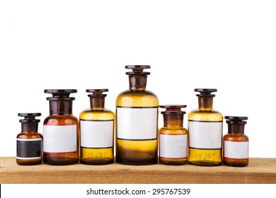 Vintage Pharmacy Bottles On Wooden Board