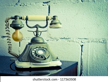 Vintage Phone Isolate On Brick Background