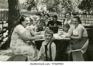 Vintage Photo Of Big Happy Family Dining Outdoor (fifties)