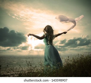 Vintage Photo of Blonde Woman with Scarf at the Sea - Powered by Shutterstock