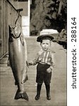 Vintage photo of a Boy Posing Next To Really Big Fish