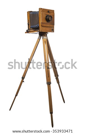 vintage photo camera on tripod isolated on white background