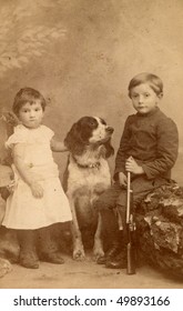 Vintage Photo Of Children With A Dog (circa 1893)