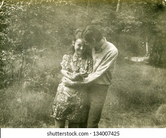 Vintage Photo Of A Couple Hugging Outdoor (seventies)