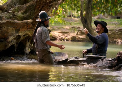 Vintage Photo Of A Cowboy Man Panning For Gold In The River.