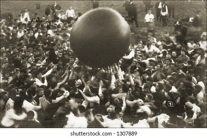 Vintage Photo Of A Crowd Tossing Large Ball Around