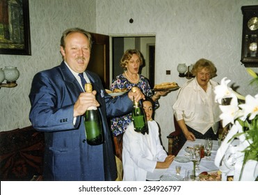 Vintage Photo Of Family Celebrating Elderly Couple's Wedding Anniversary, Eighties