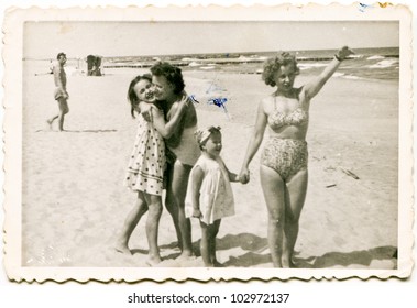 Vintage Photo Of Family On Beach (fifties)