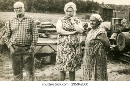 Vintage Photo Of Farmers Family (elderly Parents And Adult Daughter) On Farm, Sixties