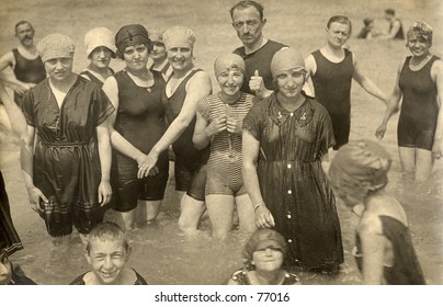 Vintage photo of group of people wading in the ocean