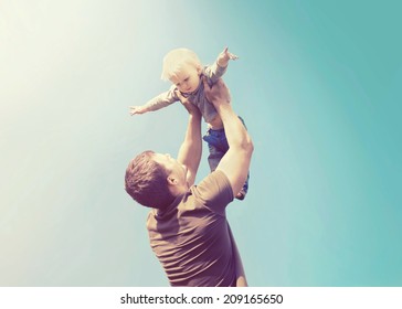 Vintage Photo Happy Father And Son Having Fun