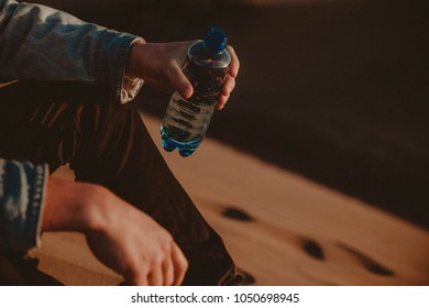 Vintage Photo. Instagram Photo. Traveler With Bottle Of Water. 