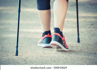 Vintage Photo, Legs Of Elderly Senior Woman In Sporty Shoes Practicing Nordic Walking, Healthy Lifestyles In Old Age