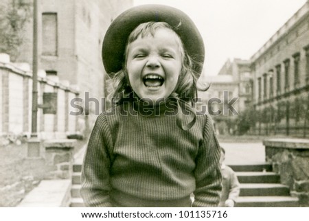 Vintage photo of little girl laughing (fifties)