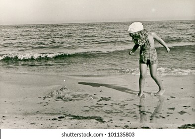 Vintage photo of little girl on beach (fifties)