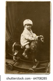 Vintage photo of little girl on rocking horse (circa 1928)