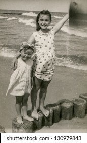 Vintage photo of little girls on beach (early eighties)