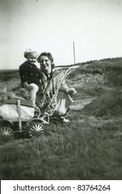 Vintage Photo Of Mother And Baby Daughter (fifties)