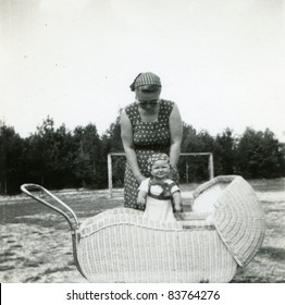 Vintage Photo Of Mother And Baby Daughter (fifties)