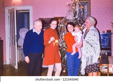 Vintage Photo Of Multigenerational Family Near Christmas Tree (early Seventies)