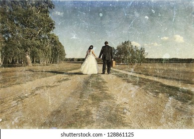 Vintage Photo Of Newlywed Couple Walking Away On Dusty Road