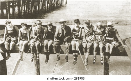 Vintage Photo Of People Fishing Off A Pier With Homemade Rods