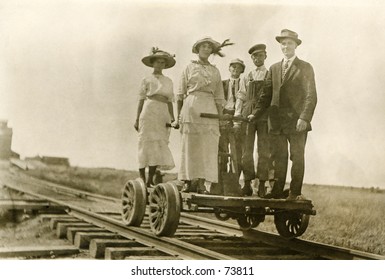 Vintage Photo Of People On A Railroad Handcart