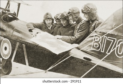 Vintage Photo Of A Pilots Poring Over Flight Plan